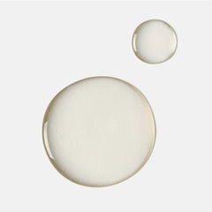 Clear mandelic acid cleanser liquid drops on white background, acne skincare texture