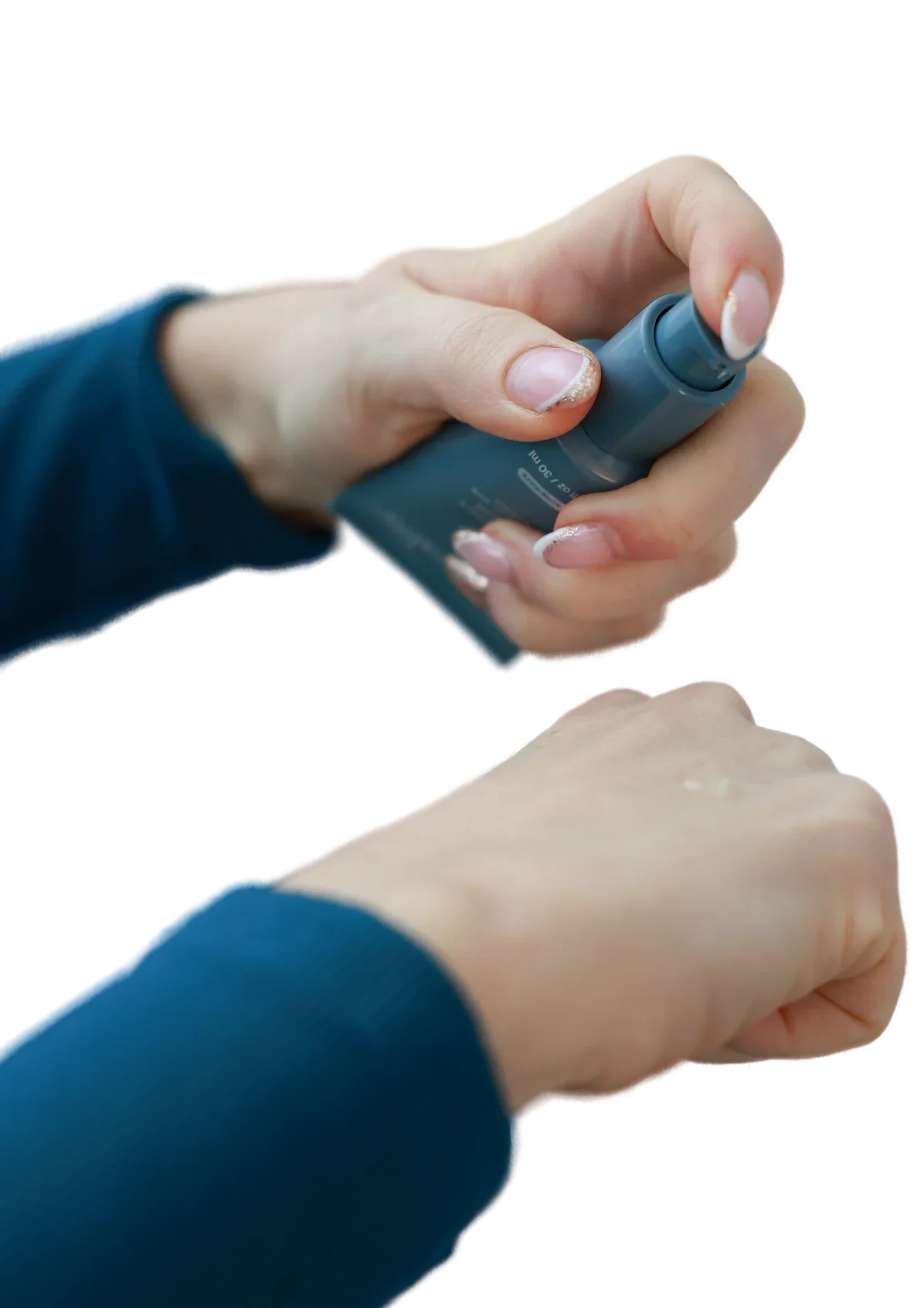 Hand applying facial skincare product from pump bottle onto back of hand