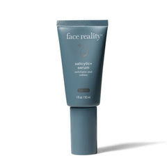 Blue skincare serum tube labeled 'face reality' on a white background