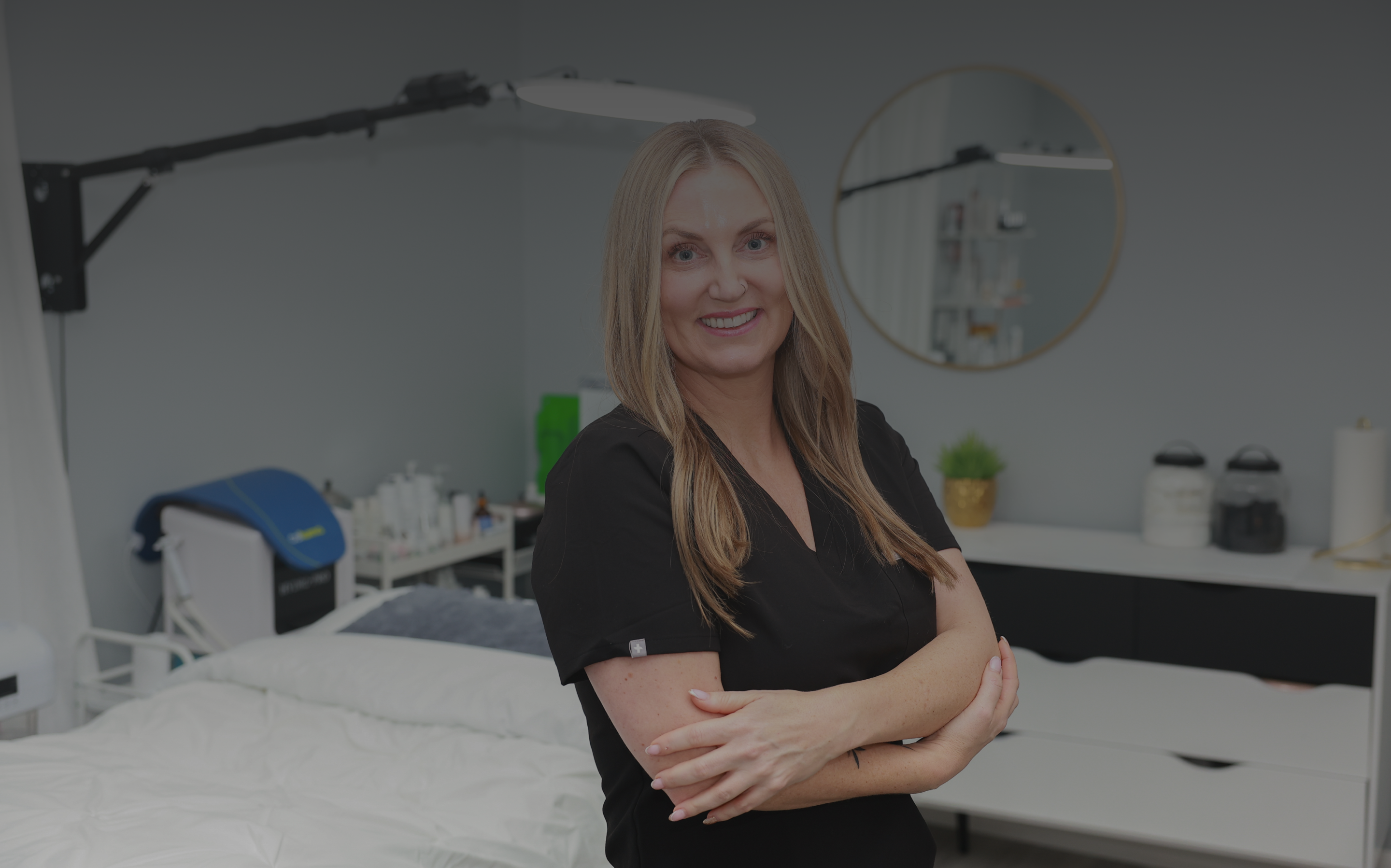 Molly standing at Ethical Esthetics offering acne scar treatments in New Hampshire.